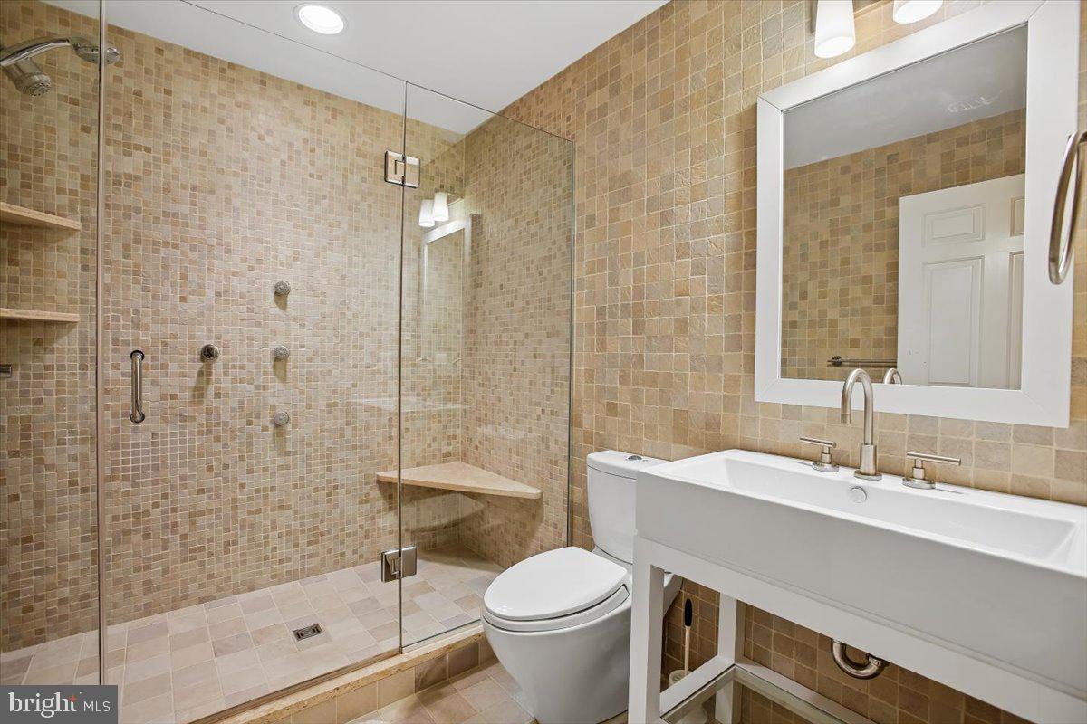 6809 Sorrel Street McLean, VA 22101 - Photo 73 of 101 a bathroom with a sink toilet and shower