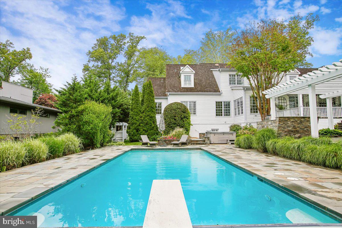 6809 Sorrel Street McLean, VA 22101 - Photo 83 of 101 a view of a swimming pool with a lounge chairs