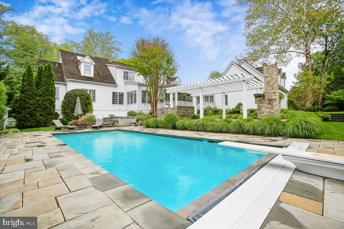 6809 Sorrel Street McLean, VA 22101 - Photo 85 of 101 a front view of a house with swimming pool and porch