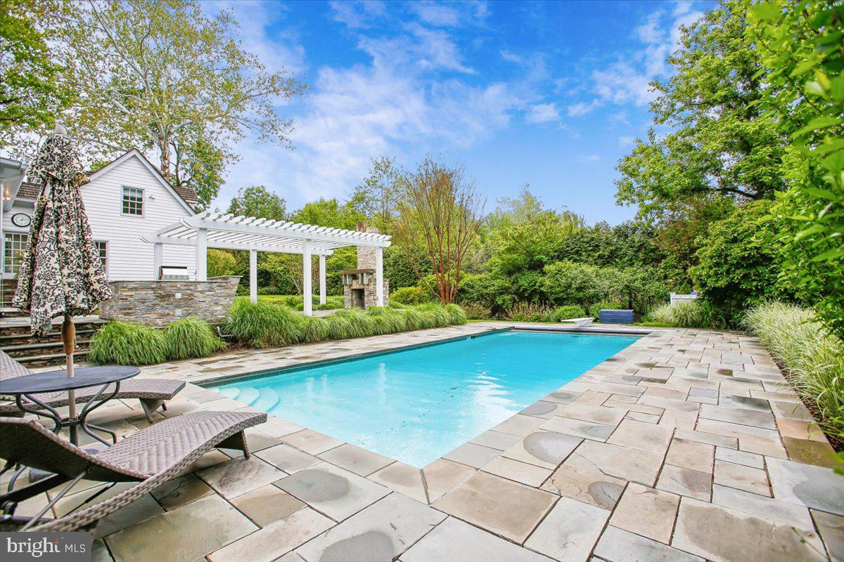 6809 Sorrel Street McLean, VA 22101 - Photo 86 of 101 a view of a patio with swimming pool table and chairs