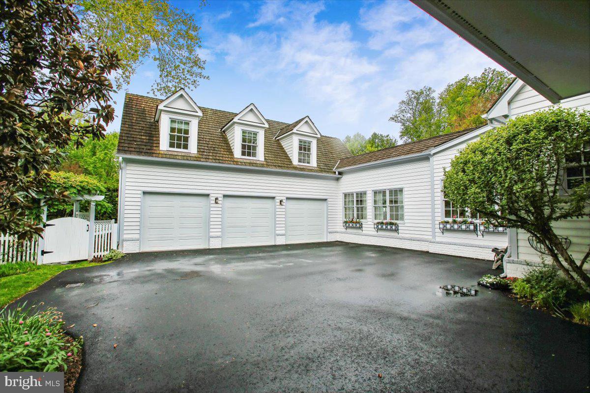 6809 Sorrel Street McLean, VA 22101 - Photo 95 of 101 a view of a house with a backyard and garage