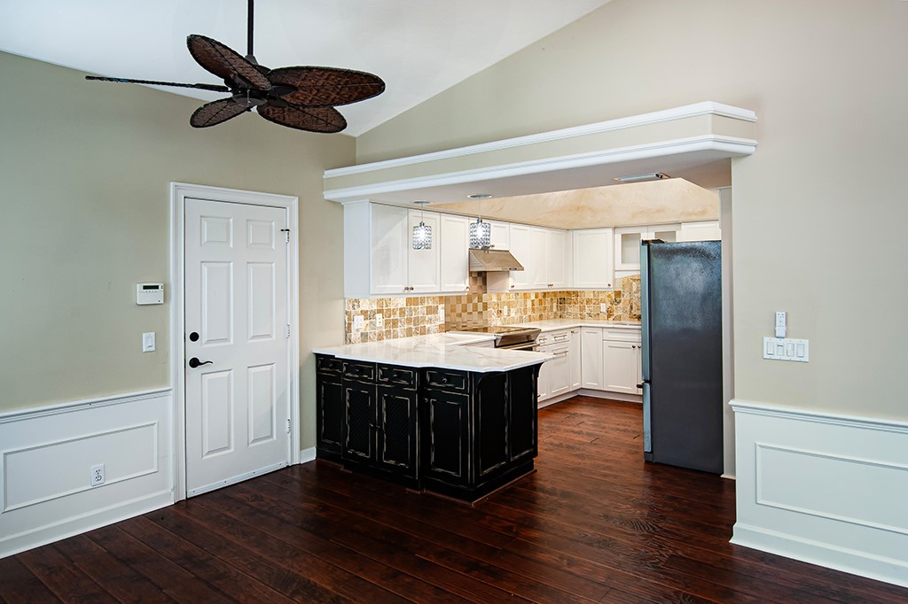 710 Timber Ridge Trail Southwest Vero Beach, FL 32962 - Photo 8 of 35 a view of kitchen with granite countertop counter space a sink appliances and cabinets