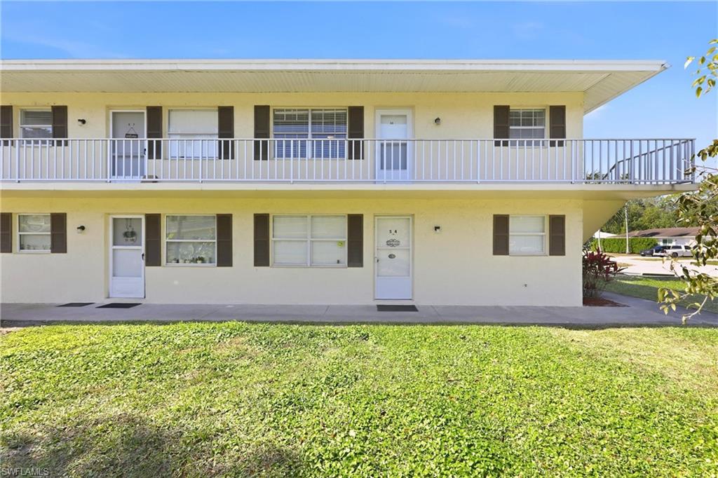 a swimming pool with outdoor seating and yard