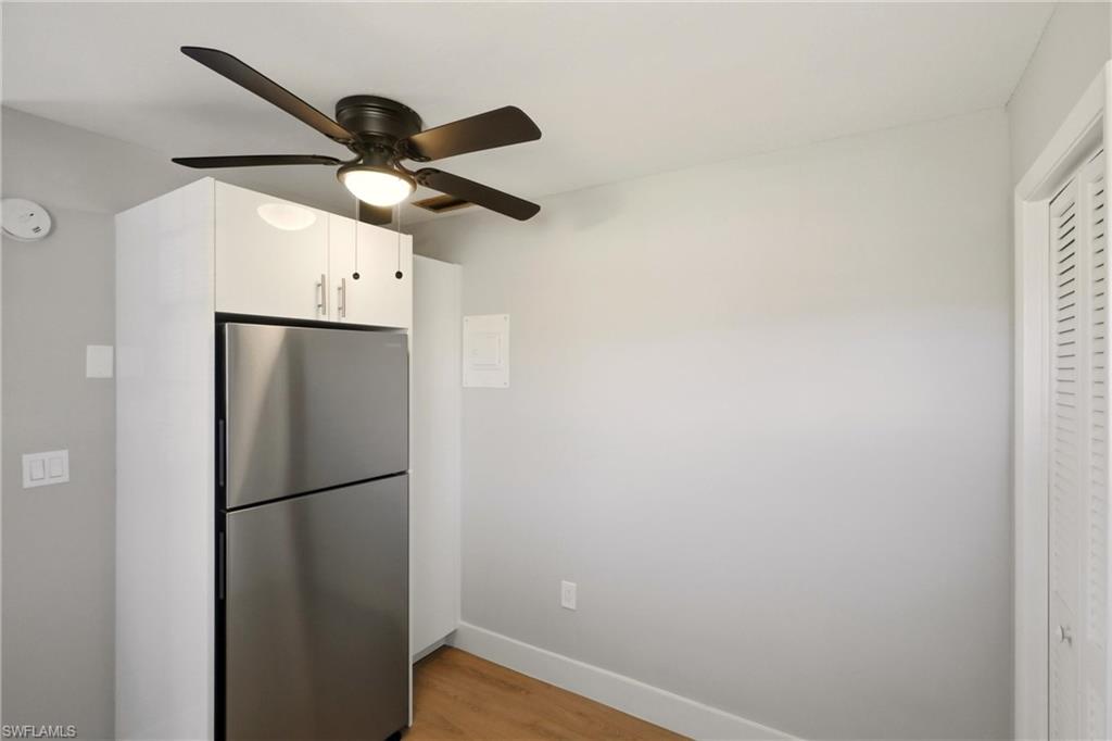 3325 Airport Road North, Unit S8 Naples, FL 34105 - Photo 11 of 33 a view of a refrigerator in a kitchen