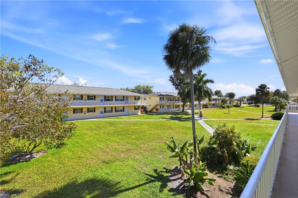 3325 Airport Road North, Unit S8 Naples, FL 34105 - Photo 20 of 33 a view of a swimming pool with a garden