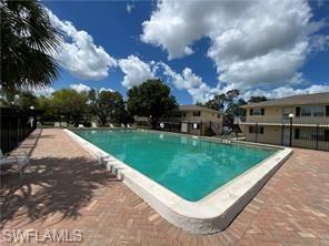 3325 Airport Road North, Unit S8 Naples, FL 34105 - Photo 2 of 3 a view of a garden and basketball court