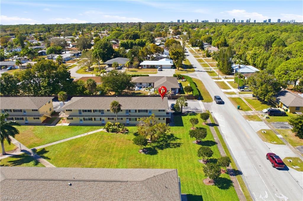 3325 Airport Road North, Unit S8 Naples, FL 34105 - Photo 24 of 33 an aerial view of tennis court