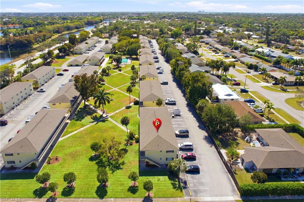 3325 Airport Road North, Unit S8 Naples, FL 34105 - Photo 26 of 33 an aerial view of residential houses with outdoor space