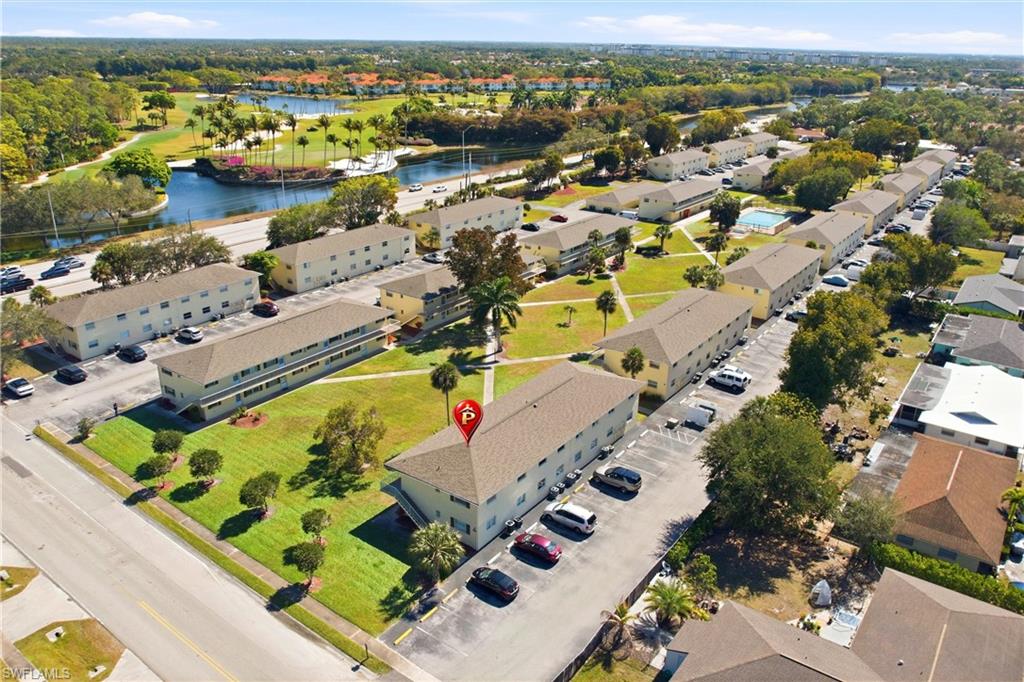 3325 Airport Road North, Unit S8 Naples, FL 34105 - Photo 27 of 33 an aerial view of a city with lawn chairs