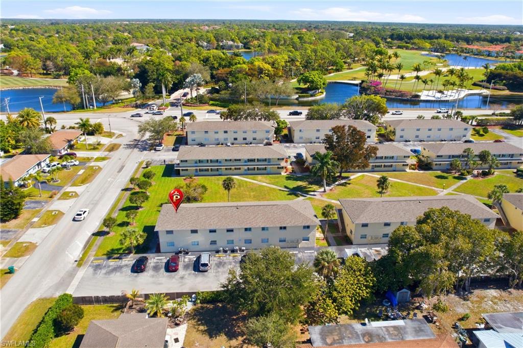 3325 Airport Road North, Unit S8 Naples, FL 34105 - Photo 28 of 33 an aerial view of residential houses with outdoor space and swimming pool