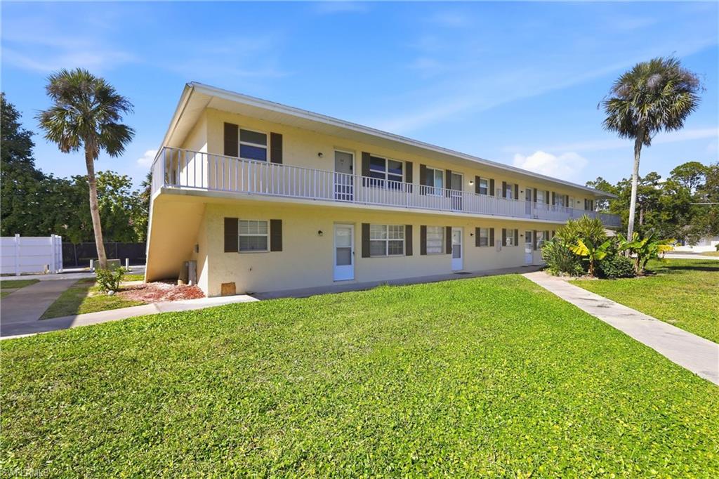 3325 Airport Road North, Unit S8 Naples, FL 34105 - Photo 3 of 33 a view of an house with backyard and a tree