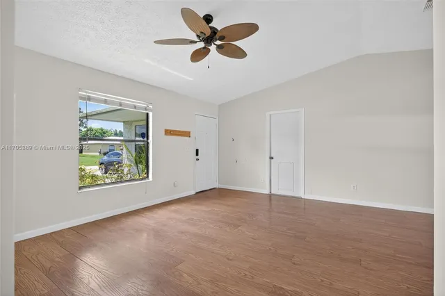 a view of an empty room with a window
