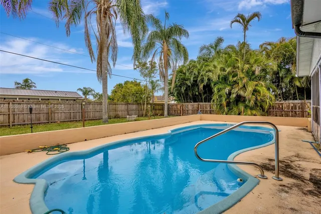 a view of outdoor space and swimming pool