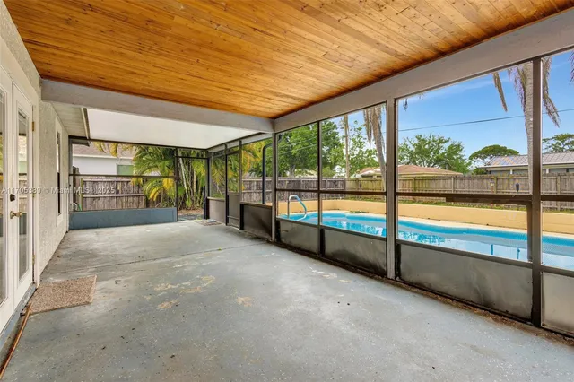a view of swimming pool with seating space