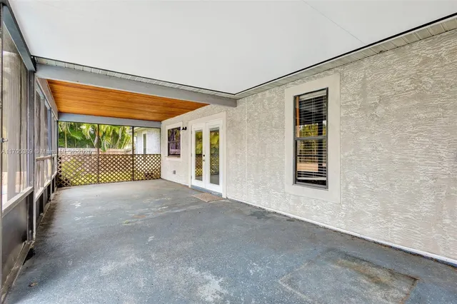 a view of an empty room with a balcony