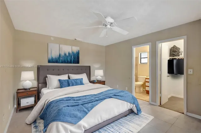 a bedroom with a bed and a mirror