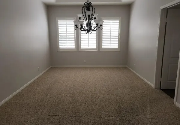 an empty room that has a window