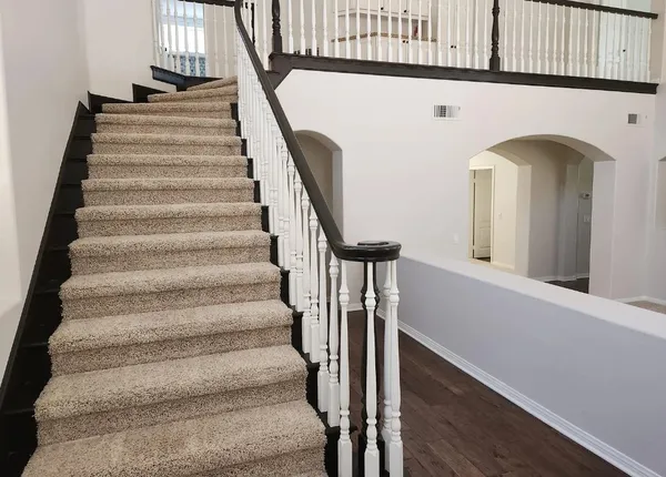 a view of entryway with wooden floor and a front door