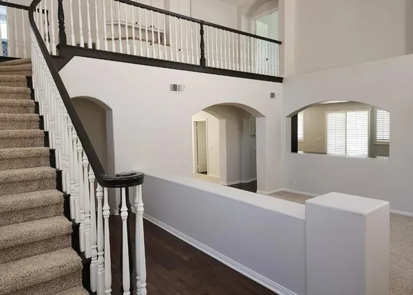 a view of an entryway with wooden floor