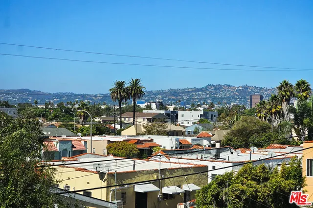 a view of a room with wooden floor and small space