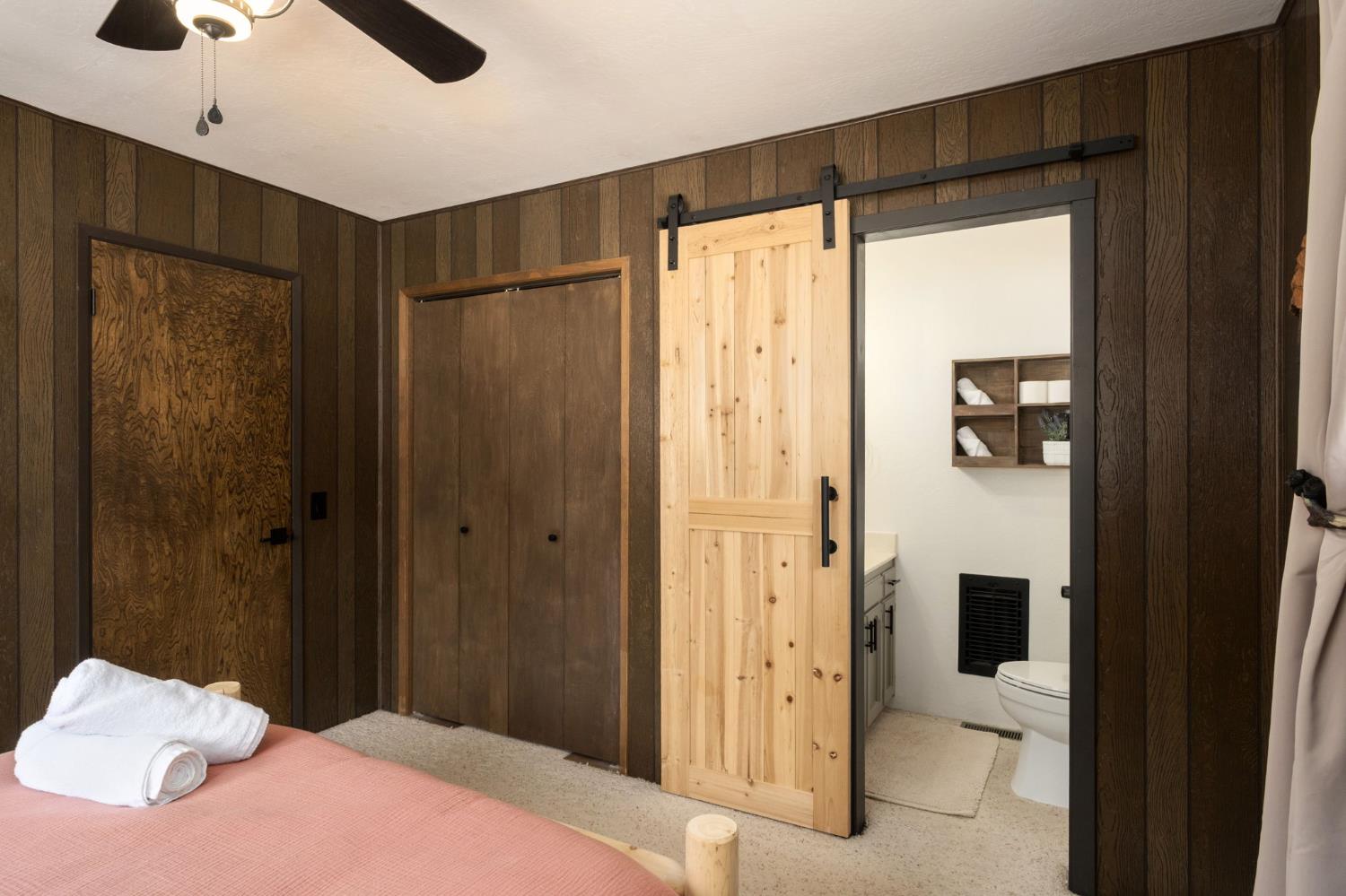 42488 Rock Ledge Road Shaver Lake, CA 93664 - Photo 19 of 26 a bedroom with a bed and a large window