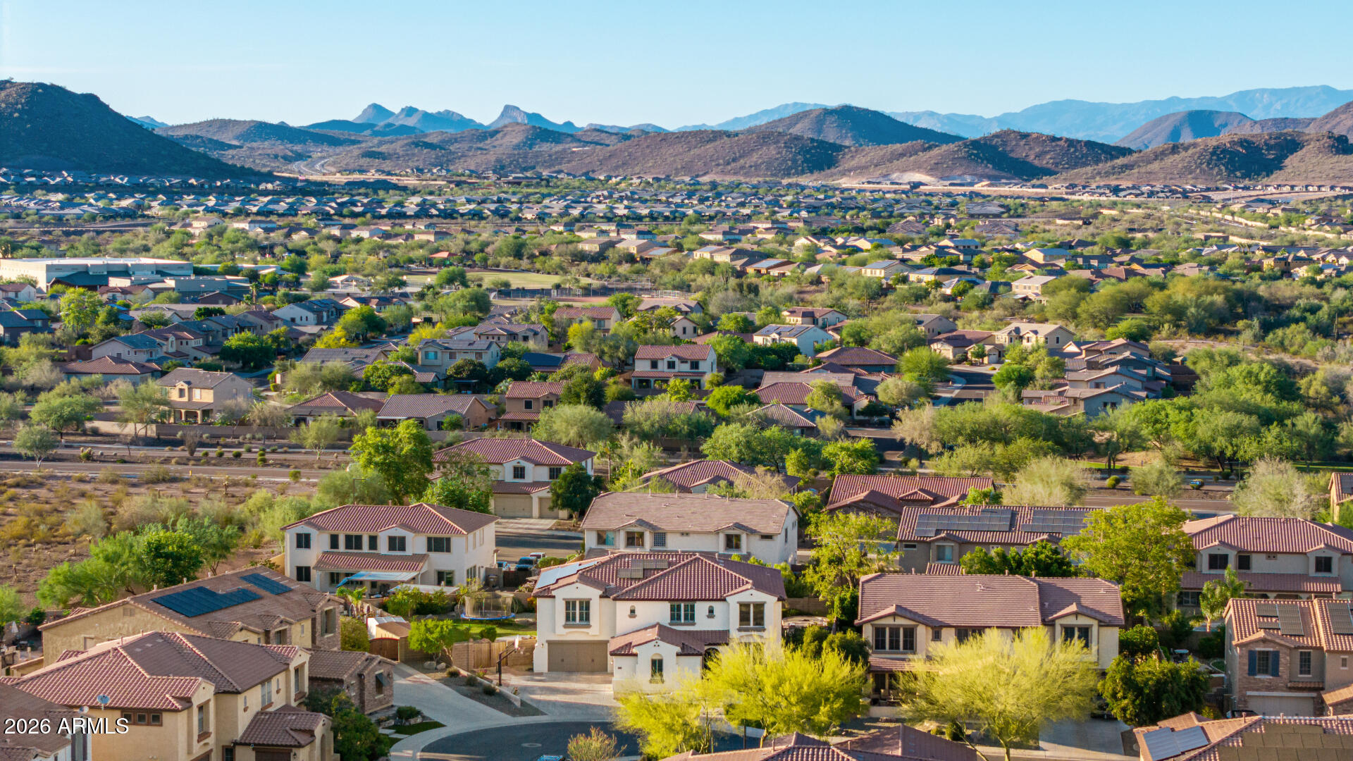 13058 West Lowden Road Peoria, AZ 85383 - Photo 111 of 122 an aerial view of residential houses and outdoor space