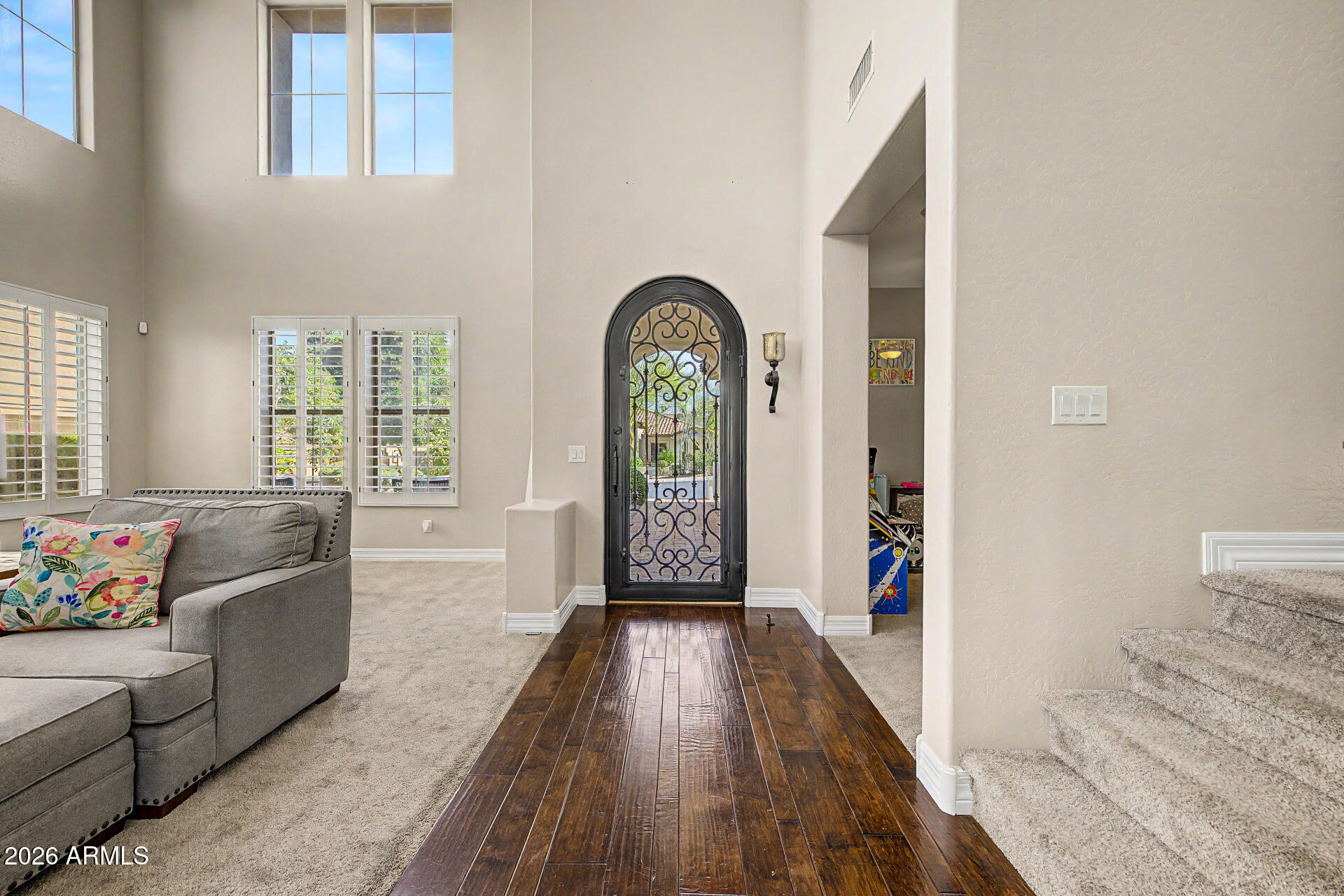 13058 West Lowden Road Peoria, AZ 85383 - Photo 12 of 122 a living room with furniture and a large window
