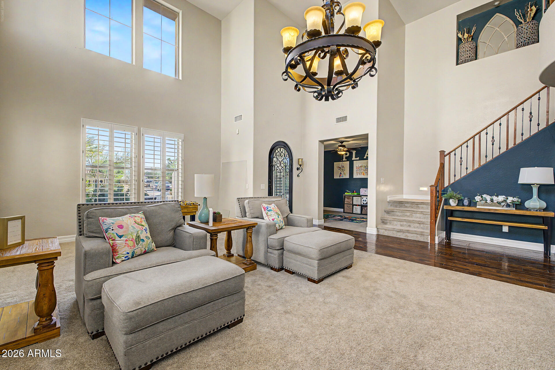 13058 West Lowden Road Peoria, AZ 85383 - Photo 13 of 122 a living room with furniture and a potted plant