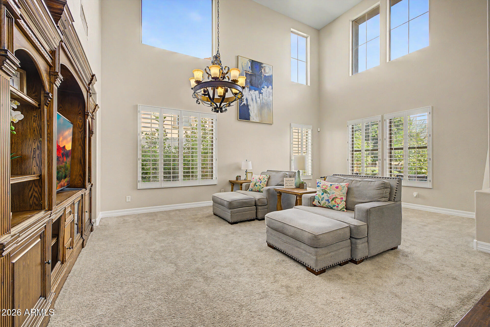 13058 West Lowden Road Peoria, AZ 85383 - Photo 14 of 122 a living room with fireplace furniture and a flat screen tv