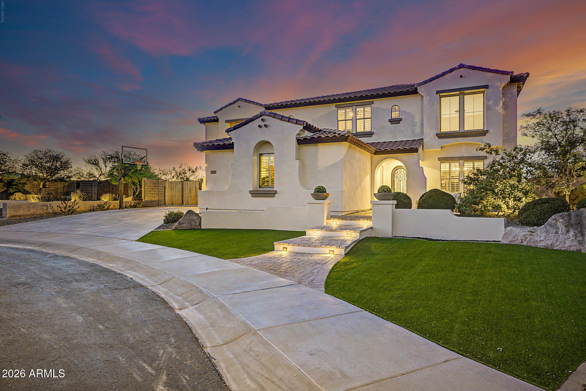 13058 West Lowden Road Peoria, AZ 85383 - Photo 2 of 122 a front view of a house with garden