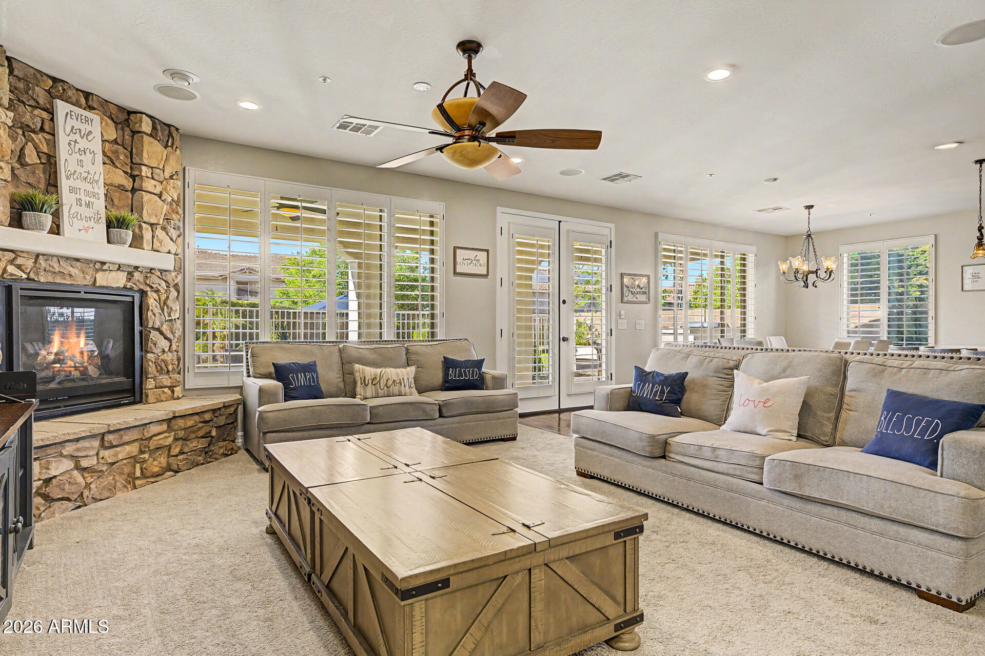 13058 West Lowden Road Peoria, AZ 85383 - Photo 27 of 122 a living room with furniture large window and flat screen tv