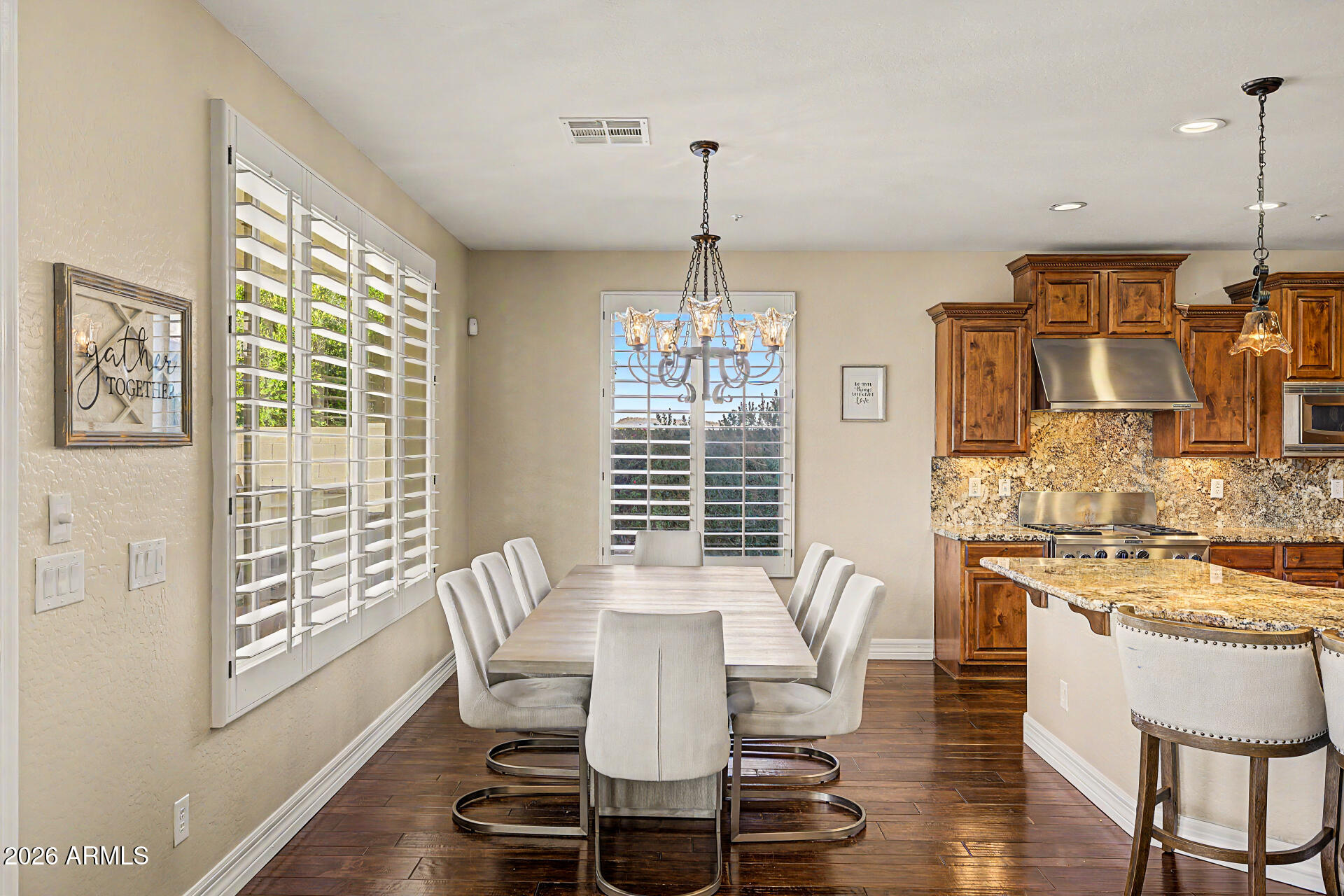 13058 West Lowden Road Peoria, AZ 85383 - Photo 36 of 122 a view of a dining room with furniture window and outside view