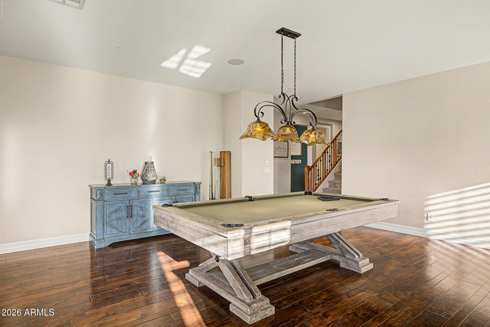 13058 West Lowden Road Peoria, AZ 85383 - Photo 40 of 122 a view of a dining room with furniture and wooden floor