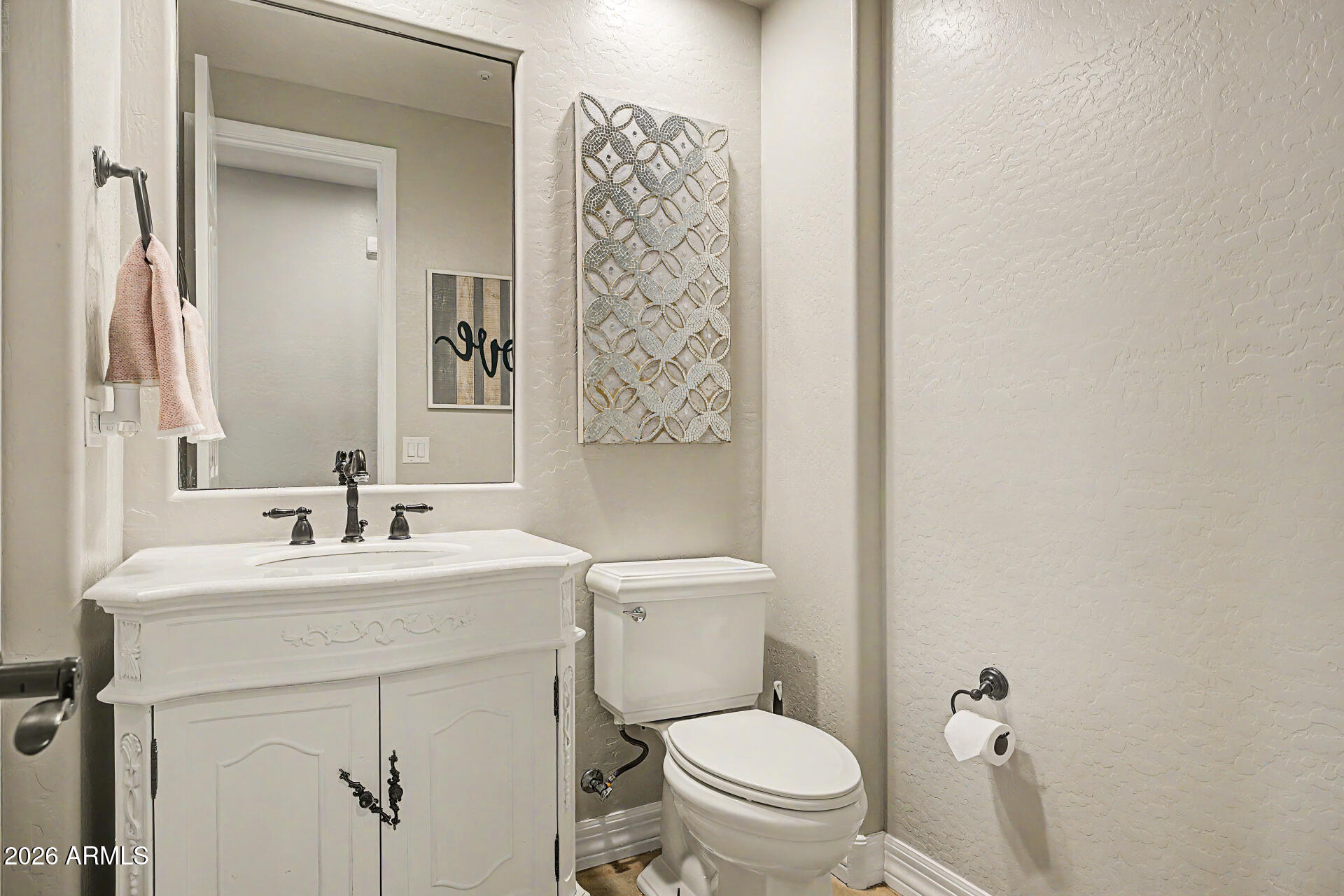 13058 West Lowden Road Peoria, AZ 85383 - Photo 46 of 122 a bathroom with a sink toilet vanity and shower