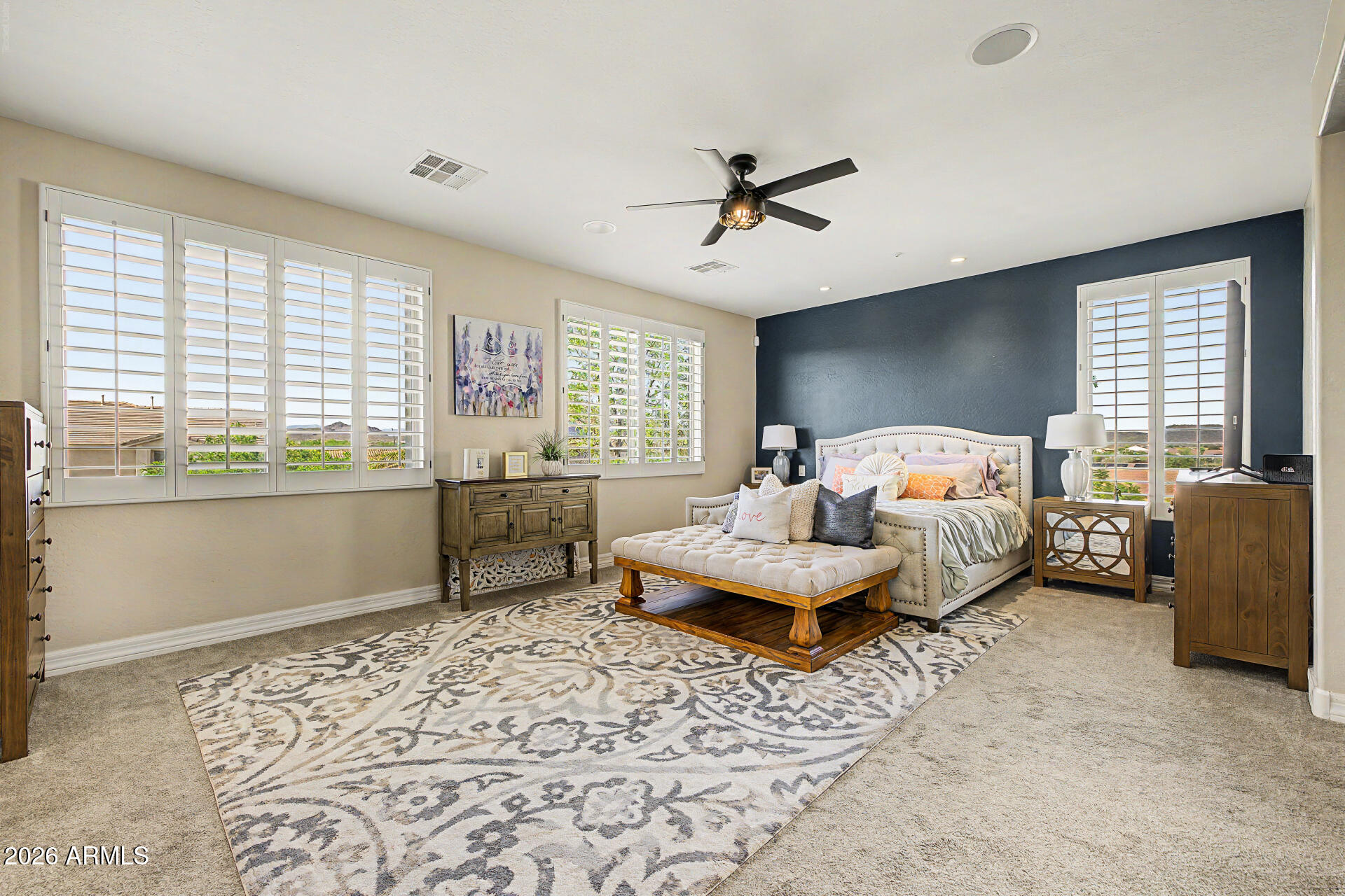 13058 West Lowden Road Peoria, AZ 85383 - Photo 50 of 122 a bedroom with a bed and large window