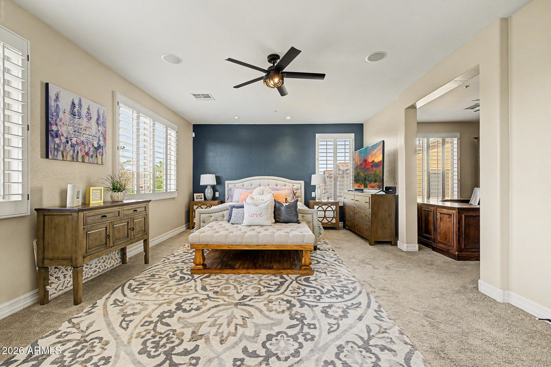 13058 West Lowden Road Peoria, AZ 85383 - Photo 51 of 122 a bedroom with furniture and a window