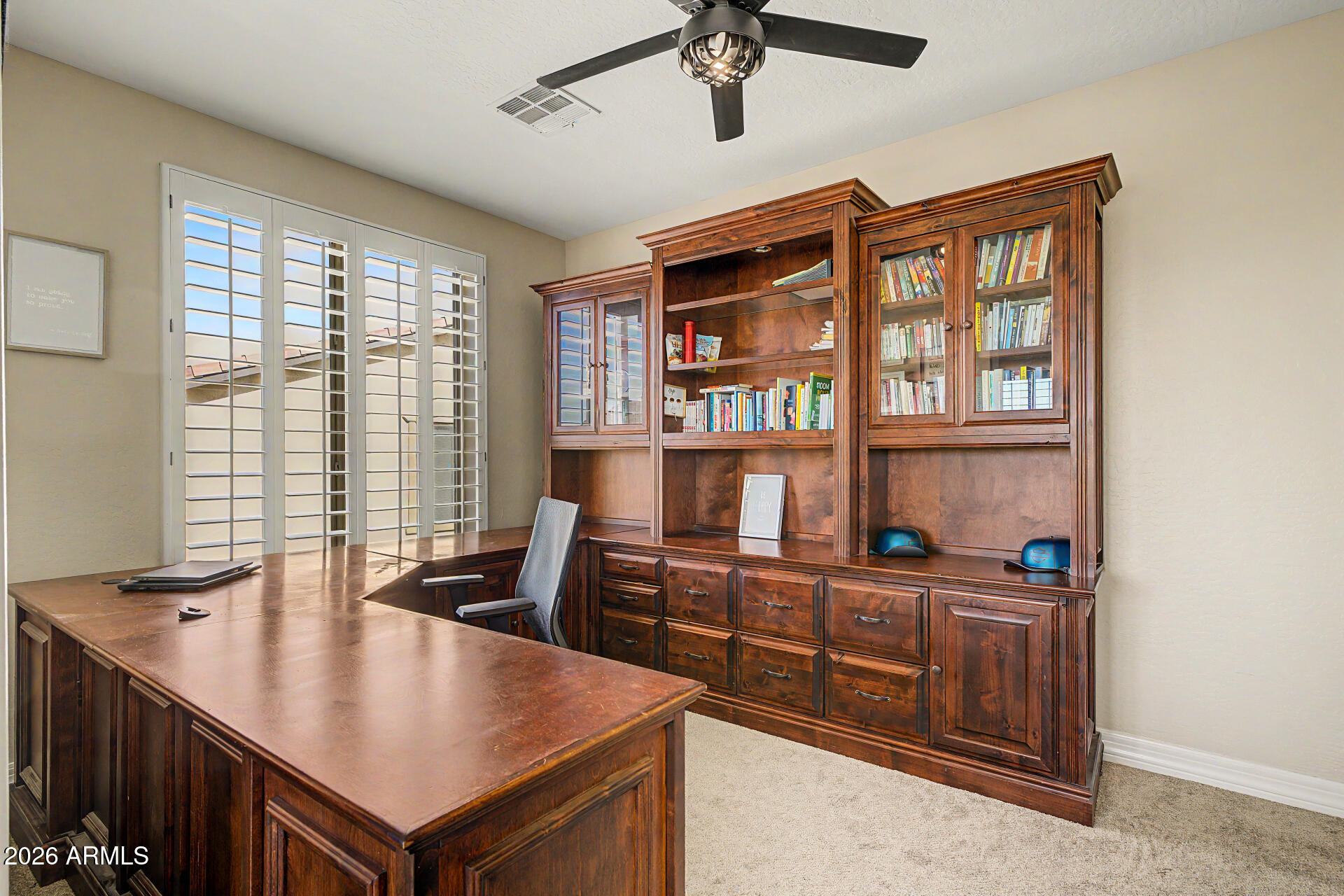 13058 West Lowden Road Peoria, AZ 85383 - Photo 54 of 122 a view of a workspace with furniture and a window