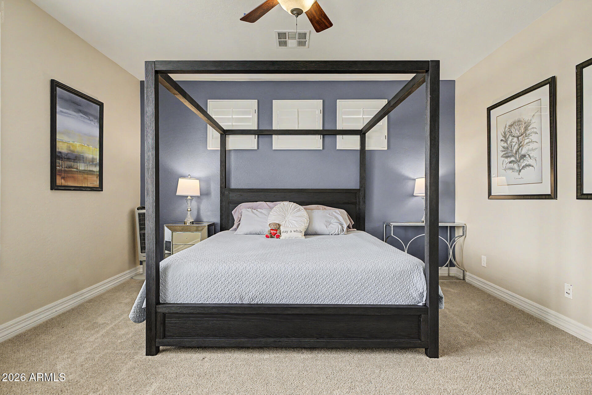 13058 West Lowden Road Peoria, AZ 85383 - Photo 58 of 122 a large bed sitting in a bedroom next to a window