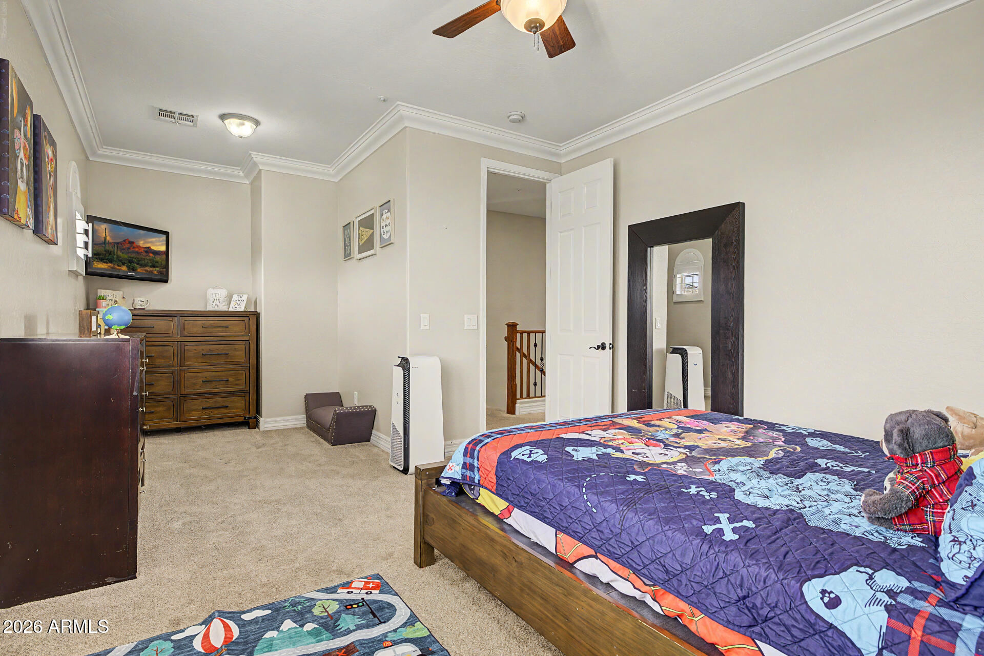 13058 West Lowden Road Peoria, AZ 85383 - Photo 64 of 122 a bedroom with a bed and flat screen tv