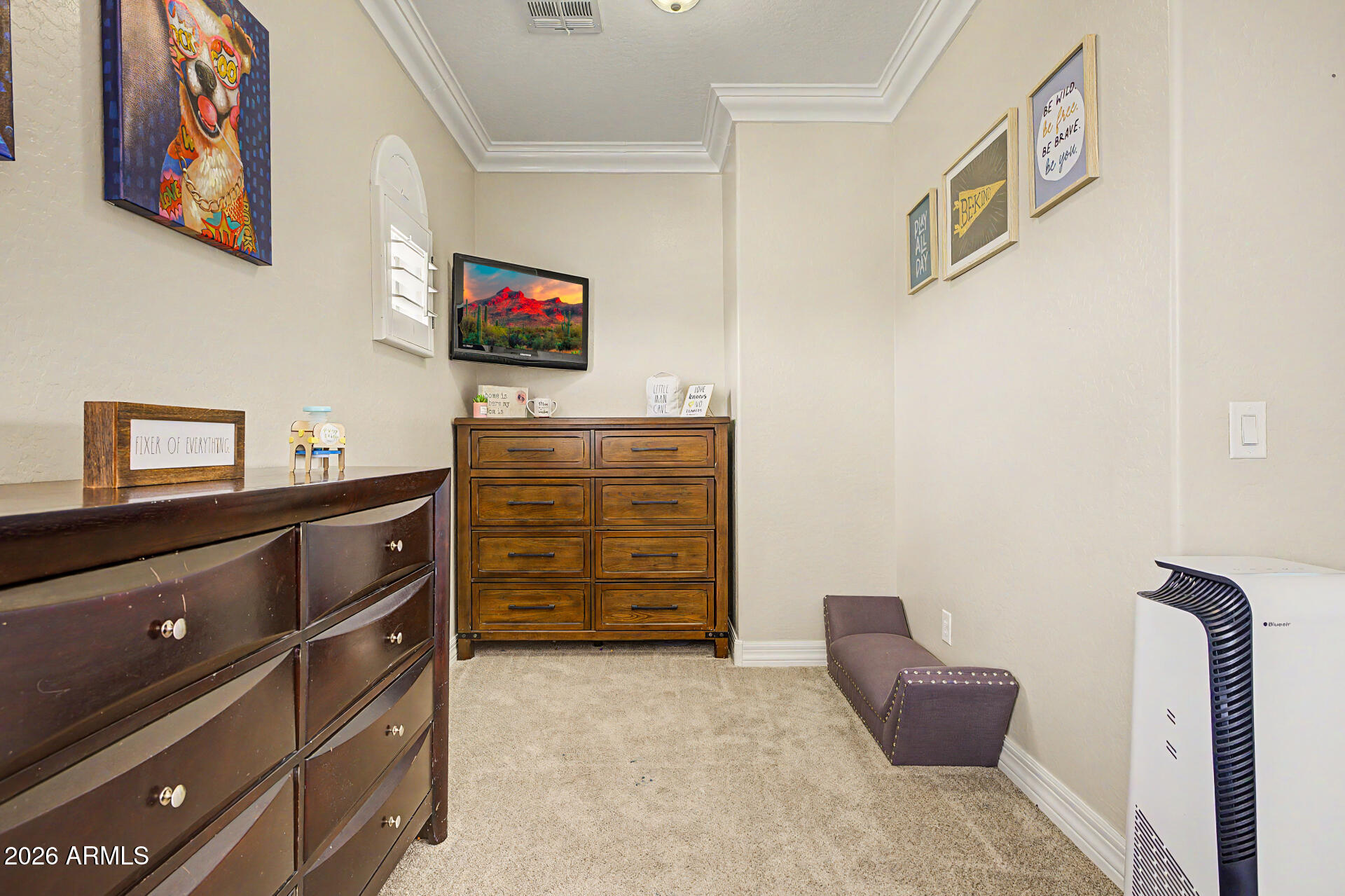 13058 West Lowden Road Peoria, AZ 85383 - Photo 65 of 122 a living room with furniture and a flat screen tv