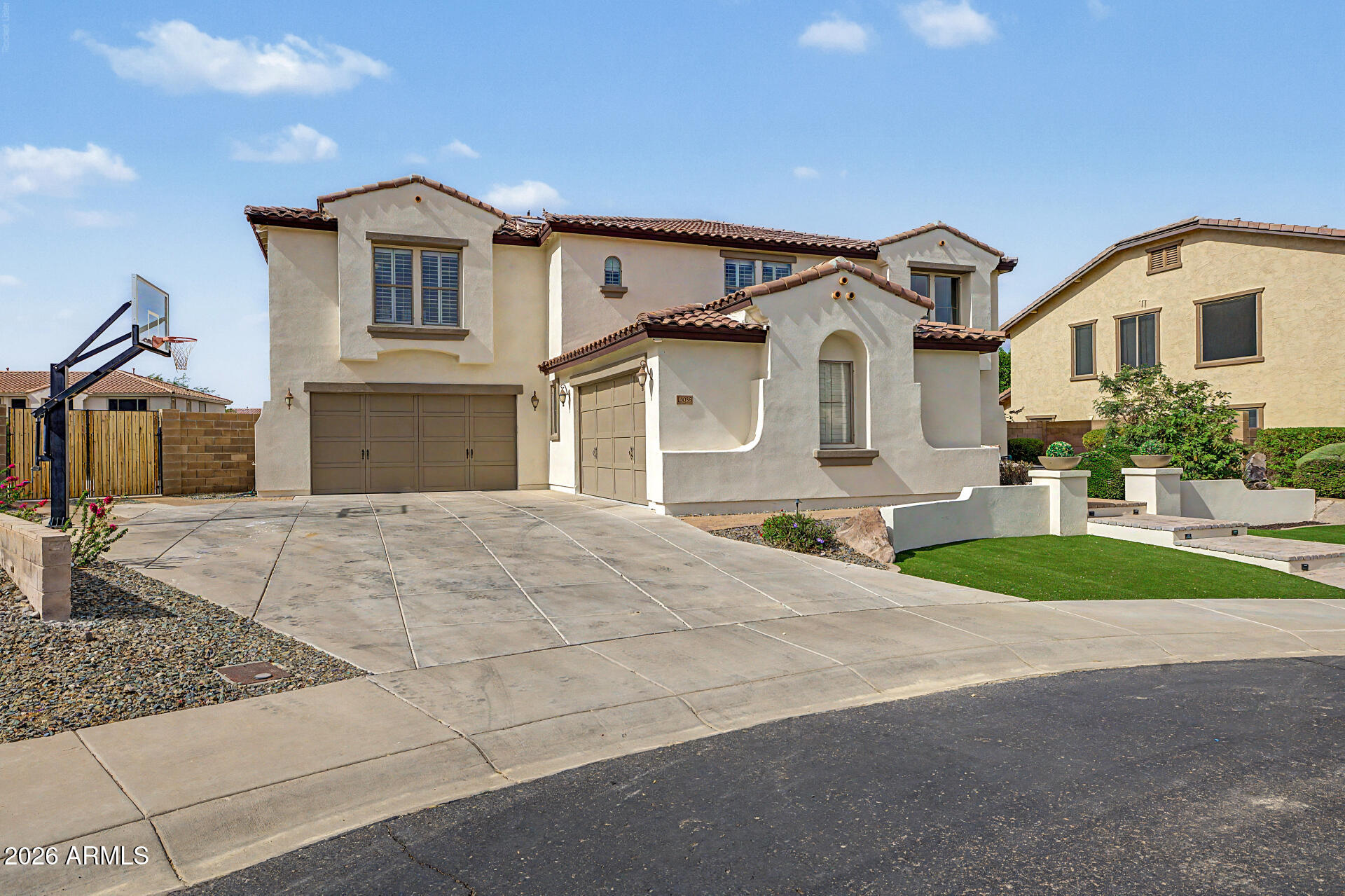 13058 West Lowden Road Peoria, AZ 85383 - Photo 7 of 122 a front view of a house with a yard and garage