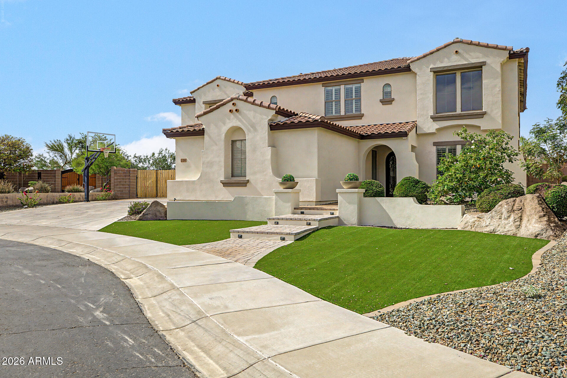 13058 West Lowden Road Peoria, AZ 85383 - Photo 8 of 122 a front view of a house with a yard