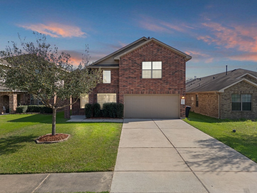 2034 Harmon Park Court Spring, TX 77373 - Photo 1 of 31 a front view of a house with garden