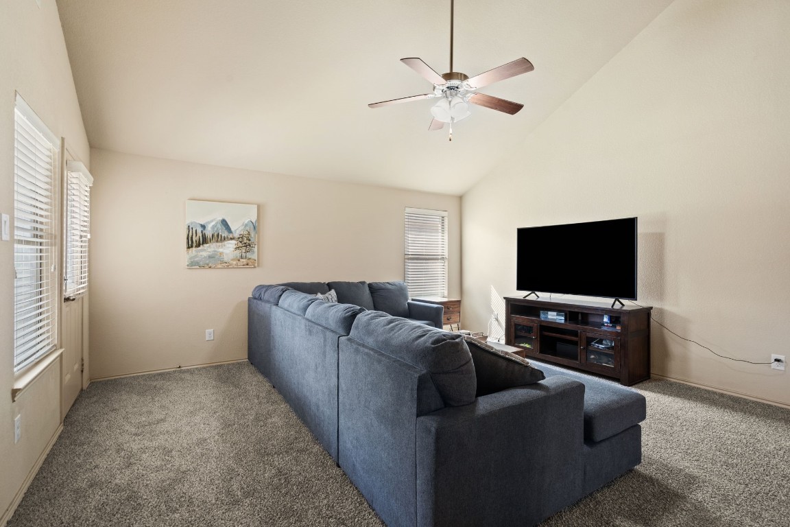 2034 Harmon Park Court Spring, TX 77373 - Photo 11 of 31 a living room with furniture and a flat screen tv