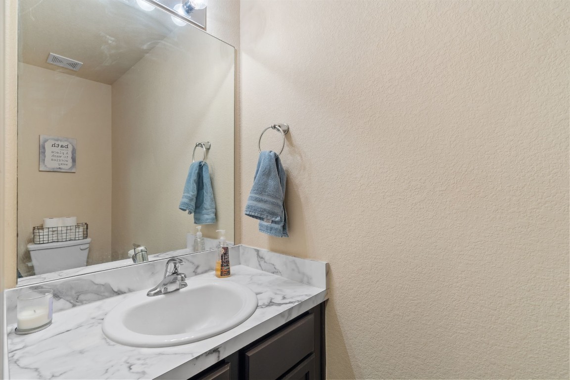 2034 Harmon Park Court Spring, TX 77373 - Photo 13 of 31 a bathroom with a sink and a mirror