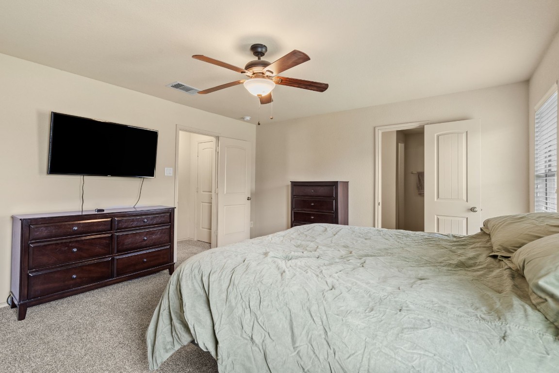 2034 Harmon Park Court Spring, TX 77373 - Photo 15 of 31 a bed room with a bed and a flat screen tv
