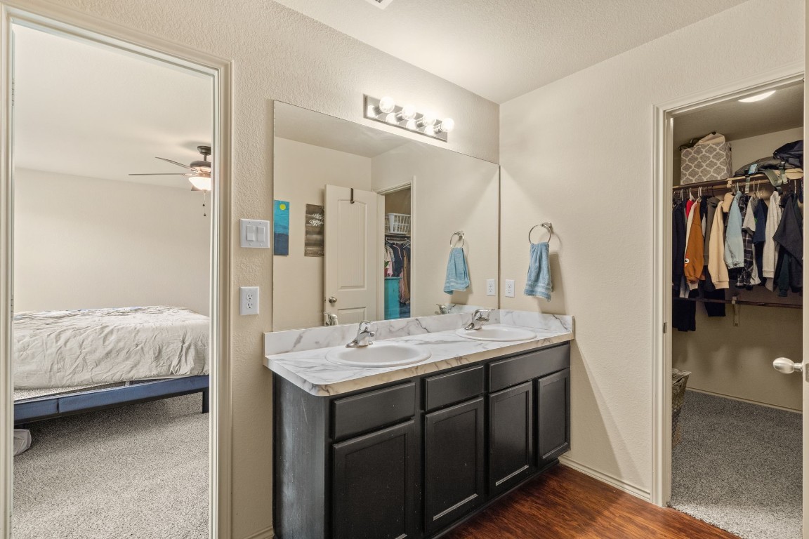 2034 Harmon Park Court Spring, TX 77373 - Photo 18 of 31 a en suite bathroom with a double vanity sink and a mirror