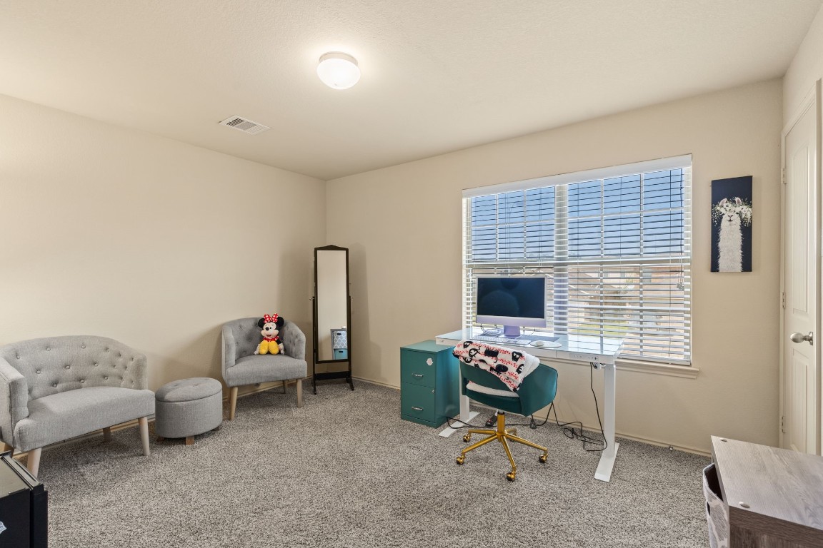 2034 Harmon Park Court Spring, TX 77373 - Photo 20 of 31 a bedroom with furniture and a window
