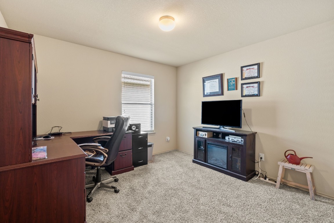 2034 Harmon Park Court Spring, TX 77373 - Photo 25 of 31 a view of a livingroom with workspace and a window