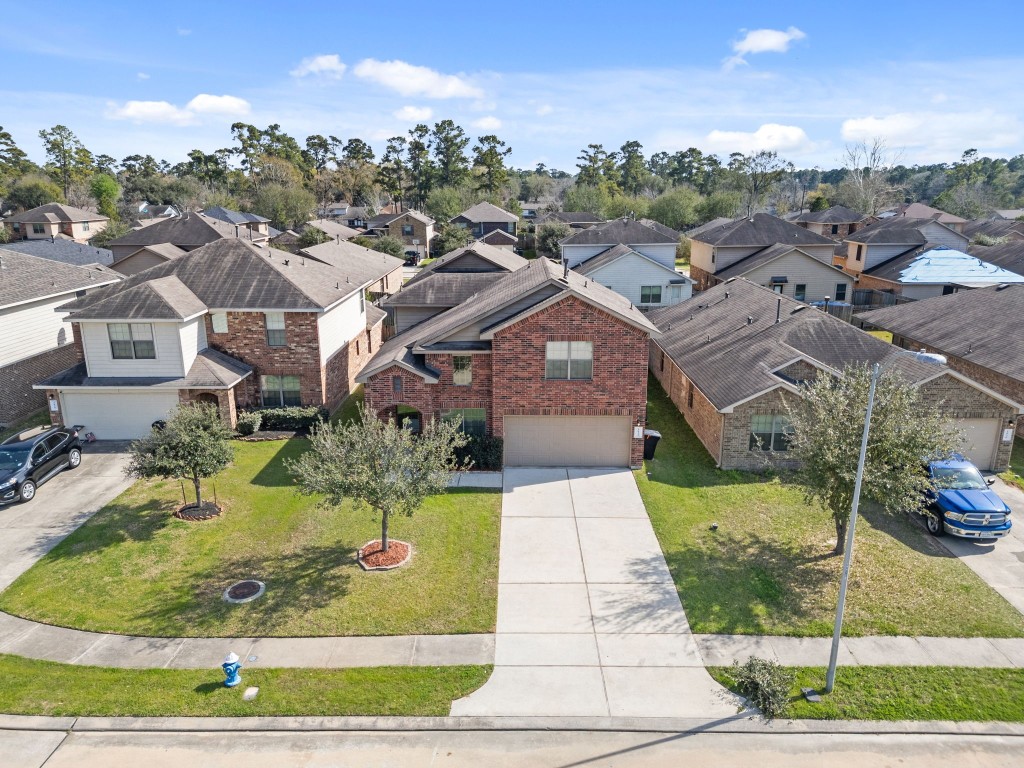 2034 Harmon Park Court Spring, TX 77373 - Photo 3 of 31 an aerial view of a house with a yard